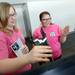 Willow Run freshman Faith Greenwood and Diana Bernal interact with a master slave controller built by Michigan PH.D. student Steve Vozar during Michigan Robotics Day at the Jack Roth Stadium Club at Michigan Stadium on Monday, April 15, 2013. Melanie Maxwell I AnnArbor.com